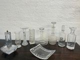 a lot of glass items sitting on a table