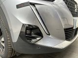 a close up of the front end of a silver car