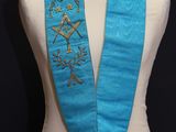 a close up of a mannequin torso with a blue scarf on it