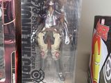 two boxes of action figures sitting on a table