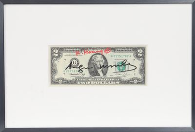 a framed picture of a $ 10 bill with a signature on it