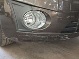a close up of a car that has been dented