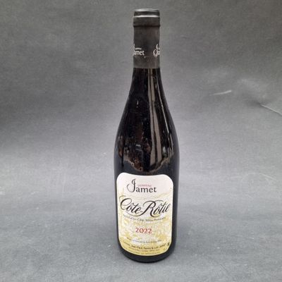 a bottle of wine sitting on top of a table