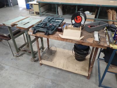 a workbench with tools on top of it in a garage