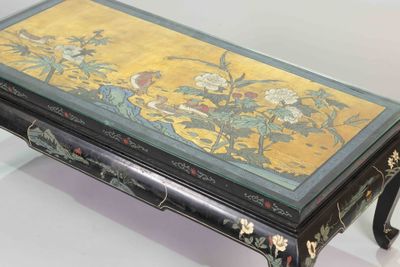 a table with a painting on it that is sitting on a table