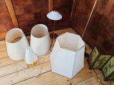 three lamps that are sitting on the floor next to each other