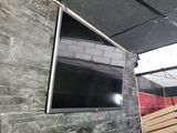 a flat screen tv mounted on a wall in a room