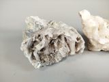 two pieces of rock that are sitting next to each other