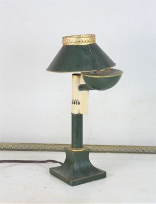 a green lamp that is sitting on a table