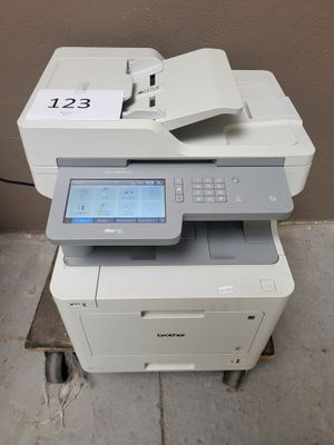 a printer that is sitting on top of a table