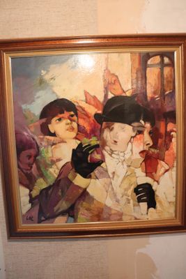 a picture of a painting on the wall above a toilet