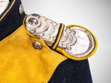 a close up of a military coat with buttons on it