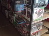 many boxes of electronics on a shelf in a store