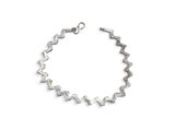silver bracelet with square cut crystals on a white background