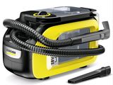 the yellow and black steam cleanerer is next to a black and gray hose