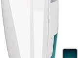 an image of a white air purifier sitting next to a cell phone