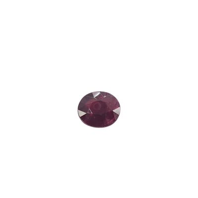 a close up of a red ruby stone on a white background