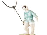 figurine représentant un homme tenant une fourche, sur fond blanc
