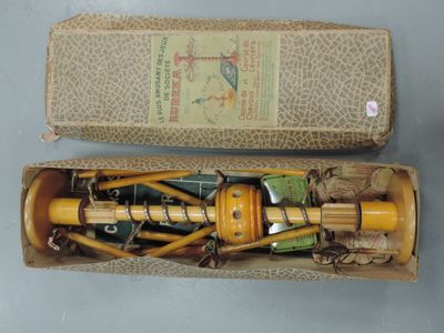 a small box with a wooden handle and a wooden handle in it