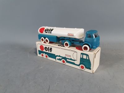 a toy truck that is sitting on top of a box