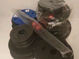 a stack of dumbs and a pair of weights on a table