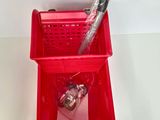 a red basket that has some items in it
