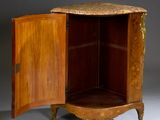 a wooden cabinet with a door open on a grey background