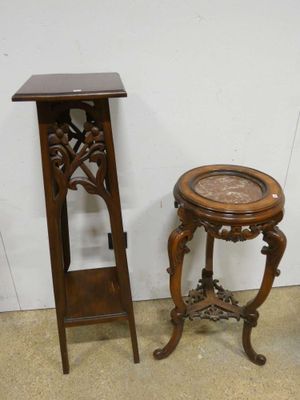 a small table with a clock on it next to a small table with a clock on it