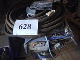 a lot of hoses and other tools on the floor