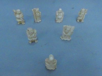 many figurines that are sitting on a blue surface