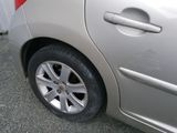 a silver car with a red stripe on the side of it
