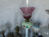 many different glass vases and vase lamps on the table