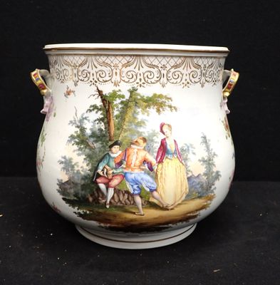 a vase with a painting on it sitting on a table