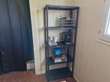a shelf that has various items on it in a room