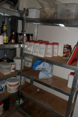 a picture of a kitchen with a lot of clutter on the floor