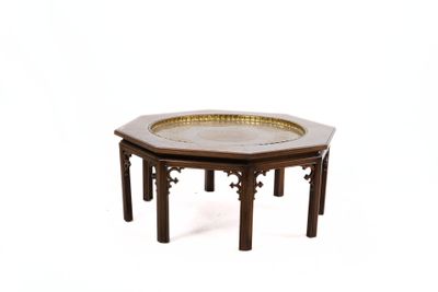a small wooden table with a metal tray on top of it