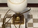 a white vase sitting on top of a marble block on the floor