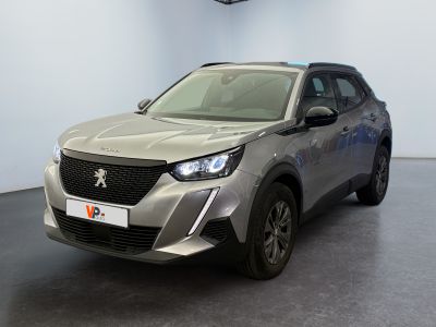 the front view of a silver car in a showroom