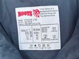 a close up of a blue jacket with a label on it