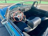 a close up of a car ' s dashboard and steering wheel