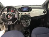 the interior of a small car with a steering wheel and dashboard