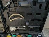 a tool kit in a black case on the floor