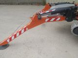 an image of a construction vehicle with a crane attached to it ' s back
