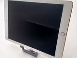 an image of a tablet computer sitting on top of a white table
