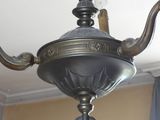 a chandelier hanging from the ceiling in a room