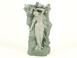 a figurine of a woman with flowers on her head
