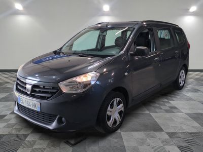 the small grey van is parked in a room with a checkered floor