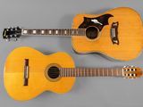 deux guitares acoustiques posées côte à côte sur une surface grise