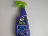 a close up of a bottle of cleaner on a table