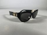 a close up of a pair of sunglasses on a white surface
